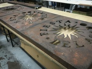 fret cut rust effect sign board with matt lacquer